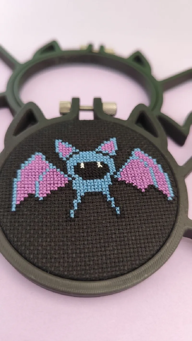 Zubat pattern framed in a Bat shaped 3D printed embroidery hoop.