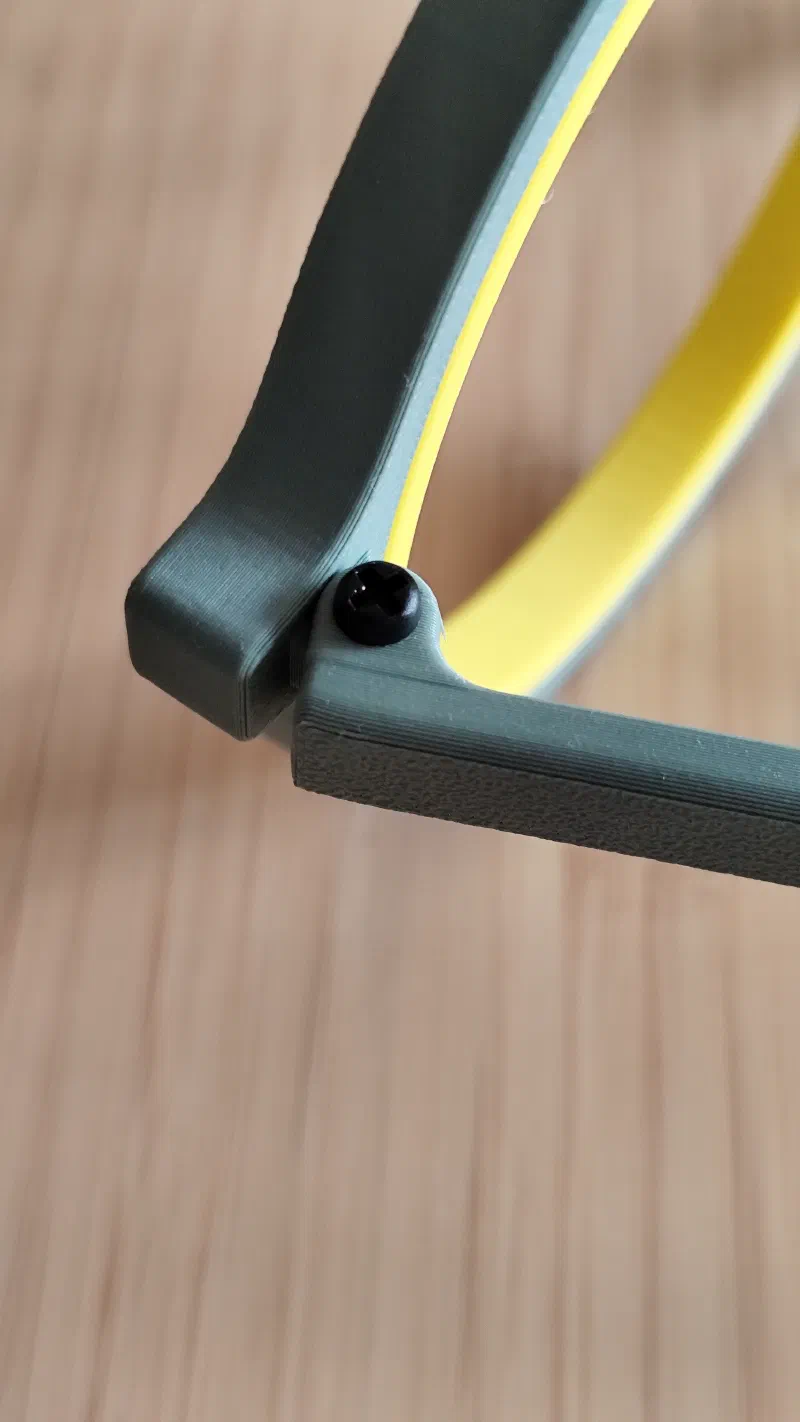Close-up of the realistic temples hinge mechanism on the glasses shaped 3D printed hoop.