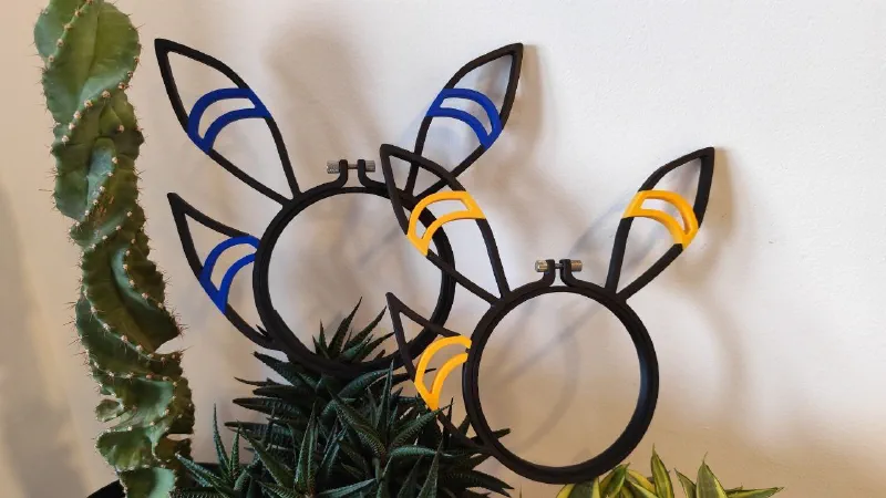 Night fox shaped embroidery hoop showcased in plants.