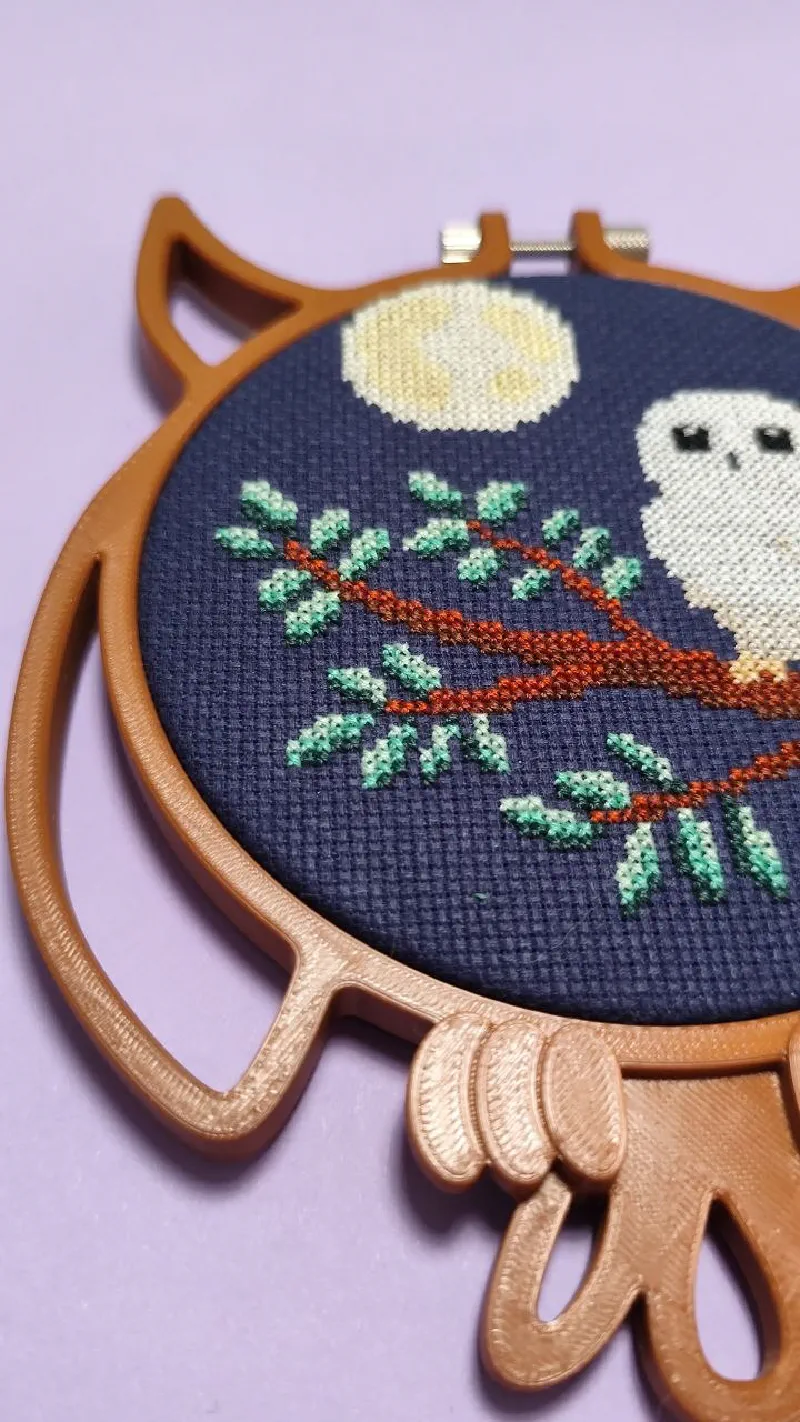 Owl pattern framed in owl shaped embroidery hoop.