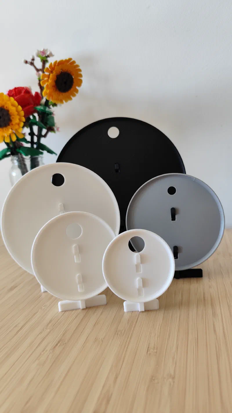 Set of 5 3D printed embroidery hoop cover and stands.